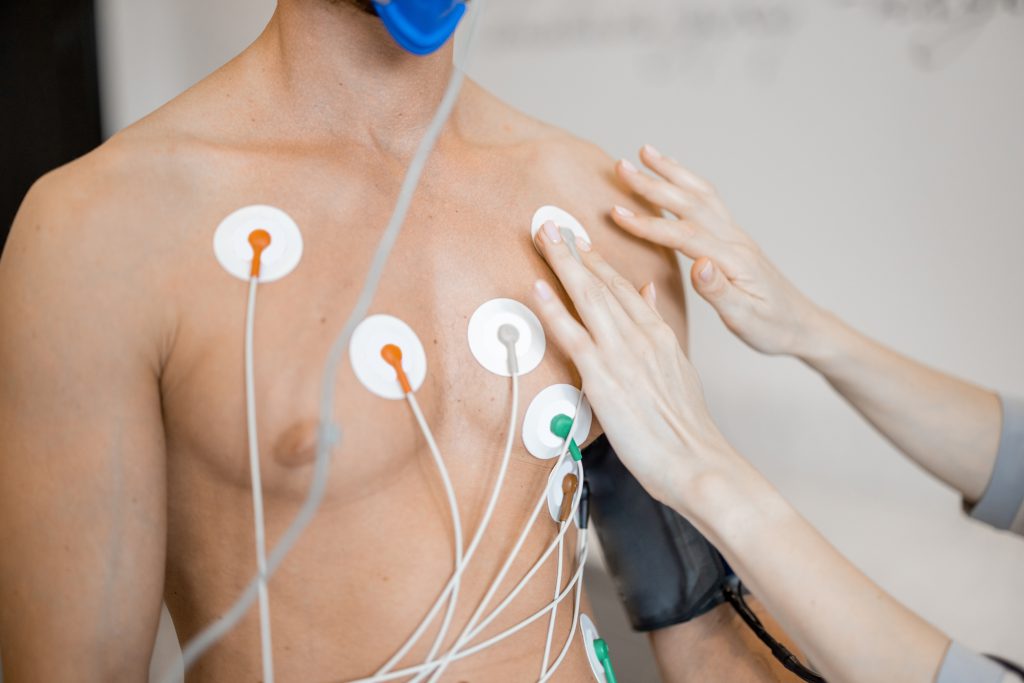 ECG electrodes being attached to a patient's chest